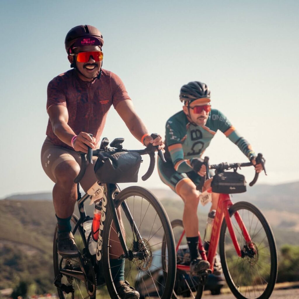 two men riding bikes